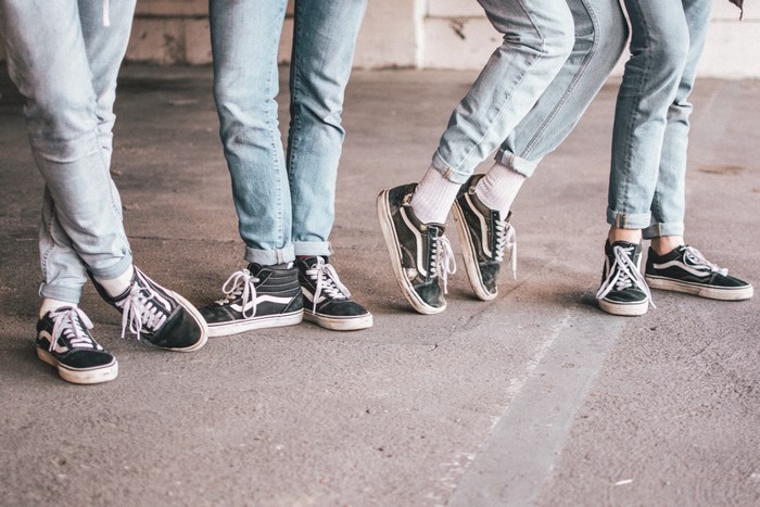 People wearing Vans sneakers and jeans