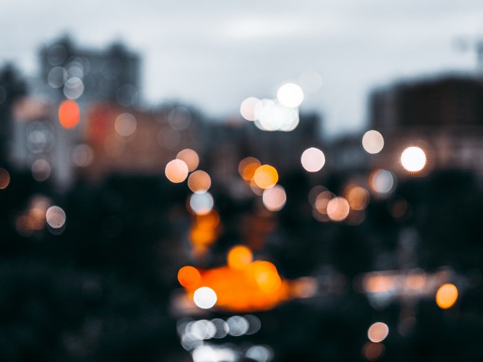 Blurred city lights at dusk with bokeh effect