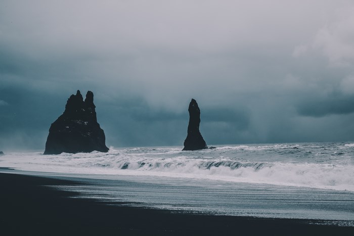 Black sand beach with rock spires in Iceland