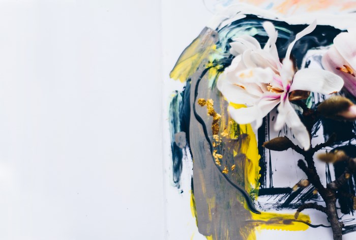Abstract painting with white flower and gold accents