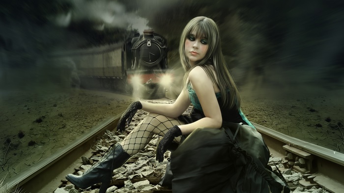 Woman on train tracks with approaching train