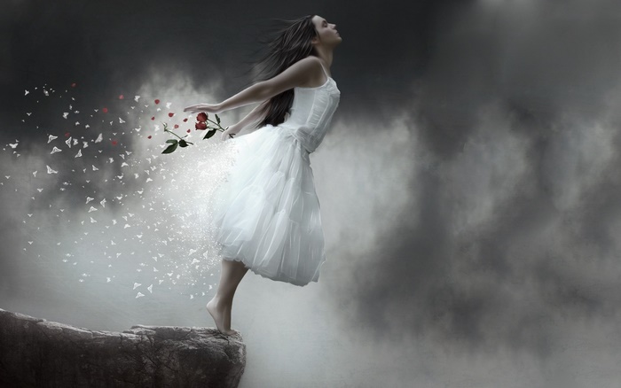 Woman in white dress dissolving into butterflies and roses