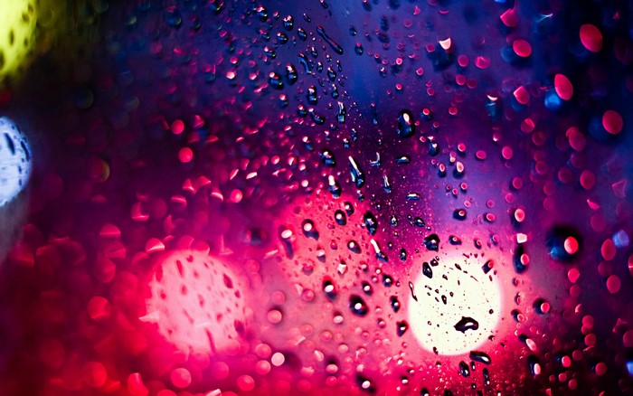 Bokeh lights and water drops on glass