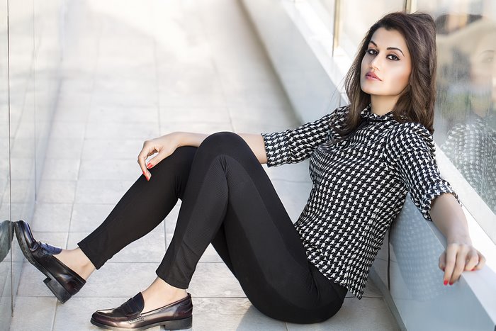 Taapsee Pannu sitting on the floor