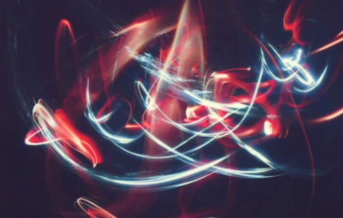 Abstract light trails with red and blue glow