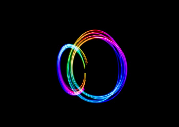 Vibrant Multicolor Light Trail Circles on Black