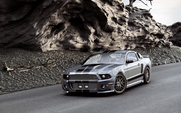 Grey Ford Mustang Shelby GT500 on a rocky road