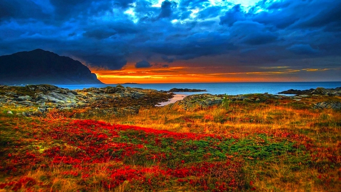 Vibrant Coastal Sunset with Dramatic Clouds