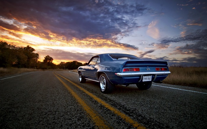 1969 Chevrolet Camaro SS on a road at sunset