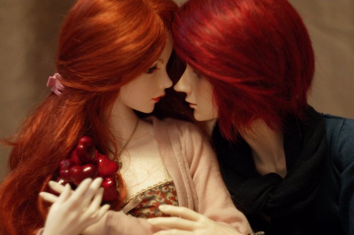 Two dolls with red hair in an intimate pose