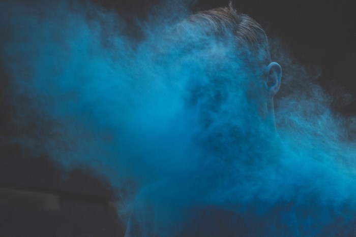 Person covered in blue powder