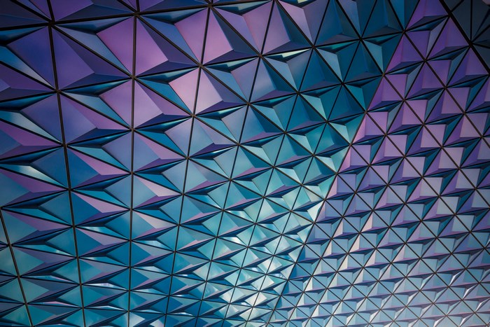 Geometric pattern of blue and purple triangular tiles