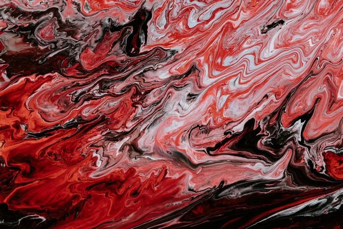 Abstract red, black, and white paint swirls