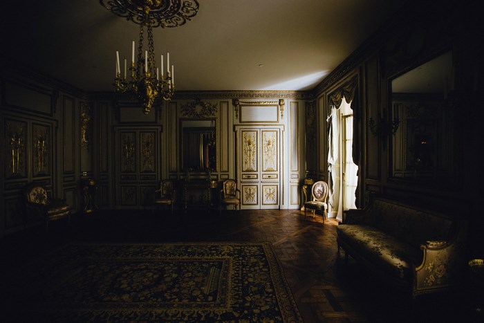 Elegant vintage French interior with chandelier and carpet