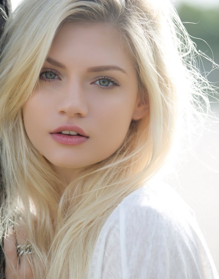 Beautiful Blonde Woman with Green Eyes