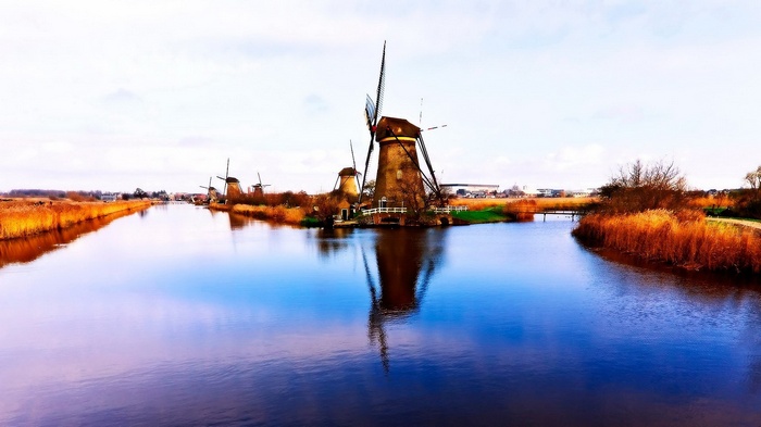 Windmills reflected in a canal in Kinderdijk
