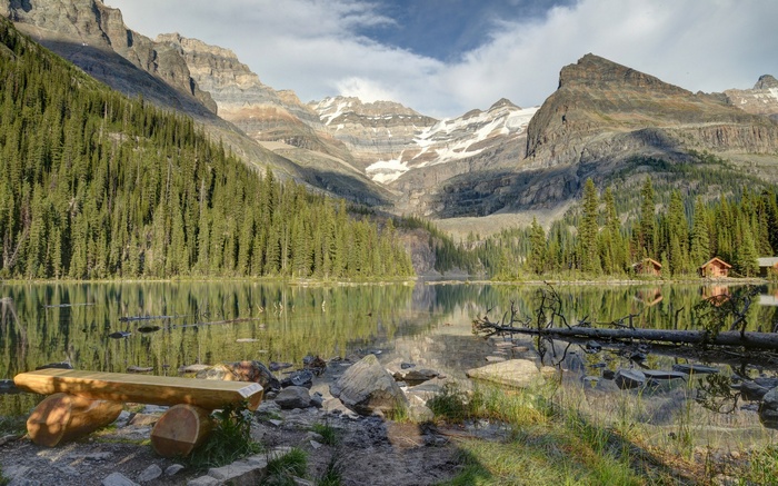 Lake with cabins and mountains