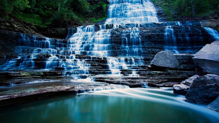 Cascading Waterfall Over Rocky Terraces