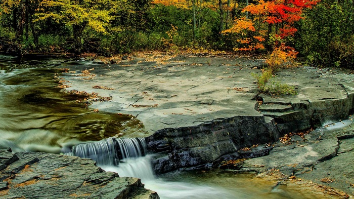 Waterfall in a forest during autumn