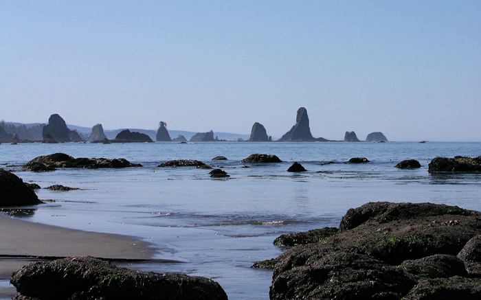 Sea stacks and rocky shore on a clear day