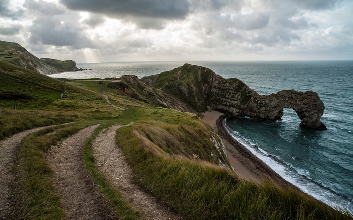Durdle Door rock arch on a cloudy day