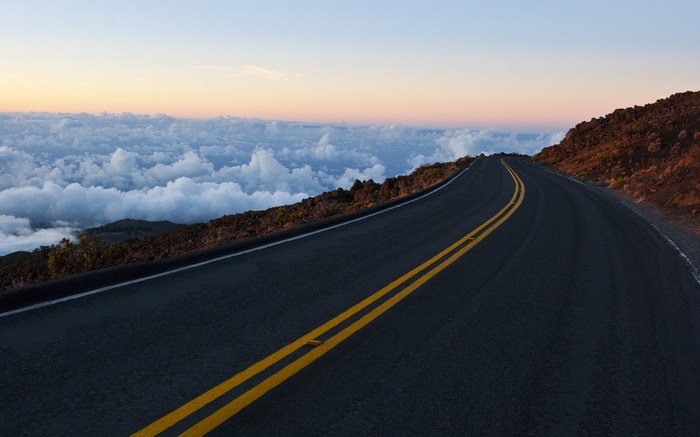 Road above clouds at sunrise