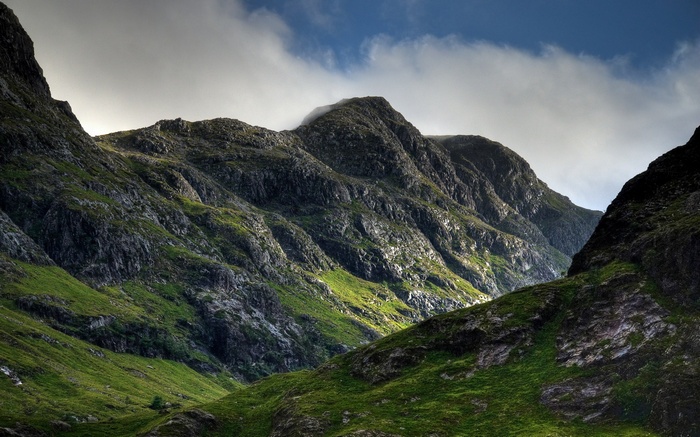 Sunlight on a grassy mountain range