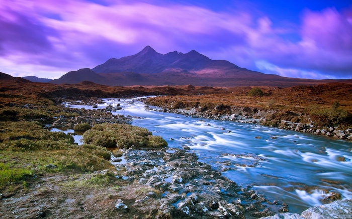 Mountain range with a river in the foreground