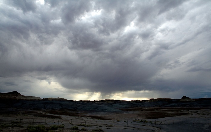 Storm clouds over a barren landscape