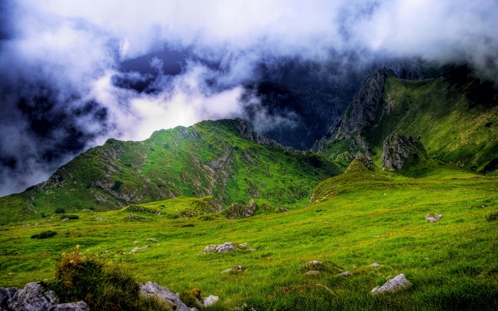 Green mountains with dramatic clouds
