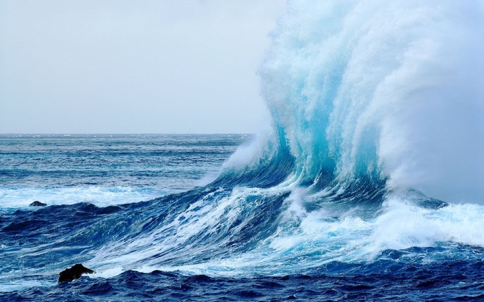 Massive wave crashing in the ocean