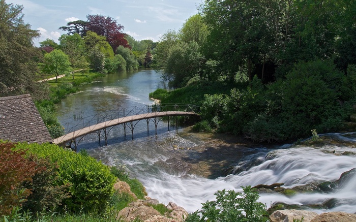Bridge over a waterfall in a park