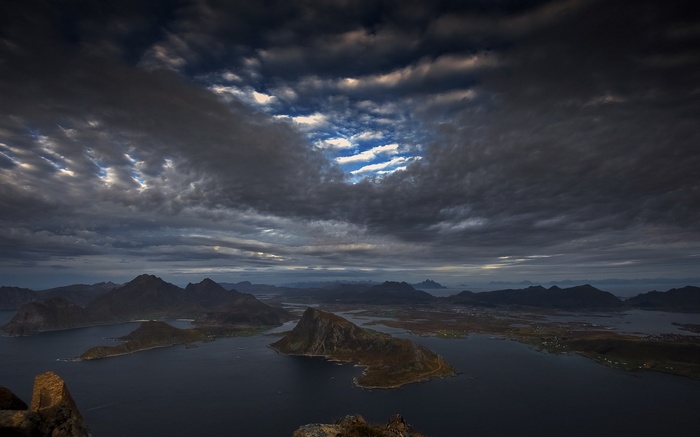 Dramatic clouds over islands and mountains