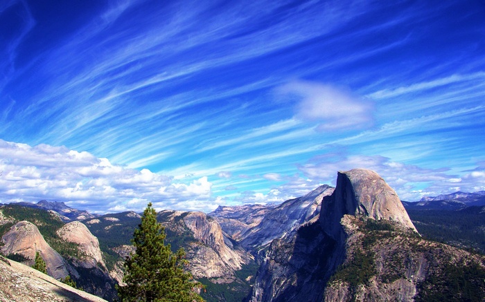 Half Dome and Yosemite Valley under a dramatic sky