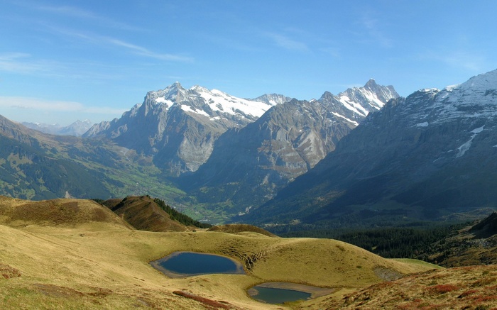 Alpine landscape with lakes and snow-capped mountains