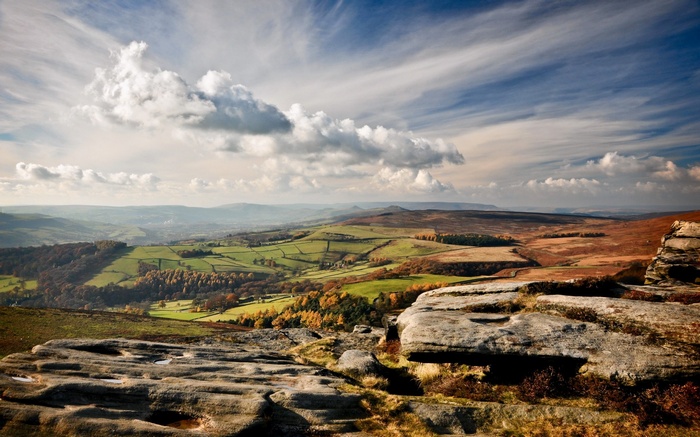 Rocky outcrop overlooking rolling hills and valleys