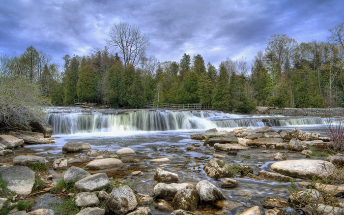 Wide waterfall with rocks and trees