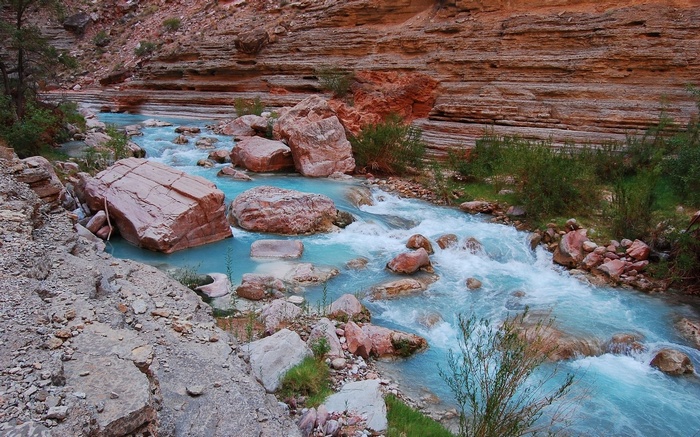 Turquoise river flowing through a rocky canyon