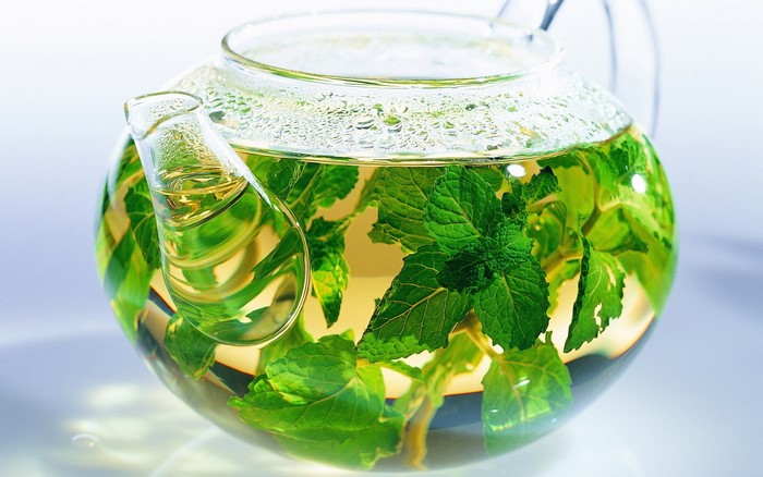Glass teapot with mint tea