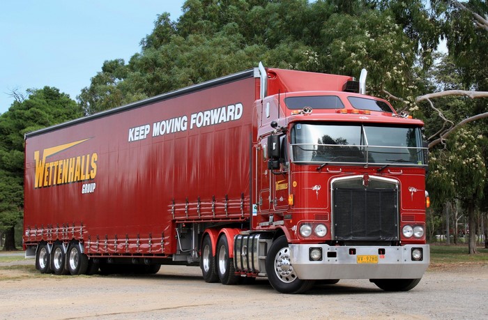 Red Kenworth Truck with Wettanhalls Group Trailer