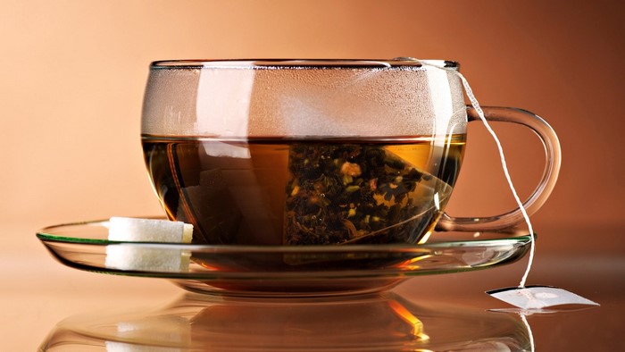 Cup of tea with sugar cubes
