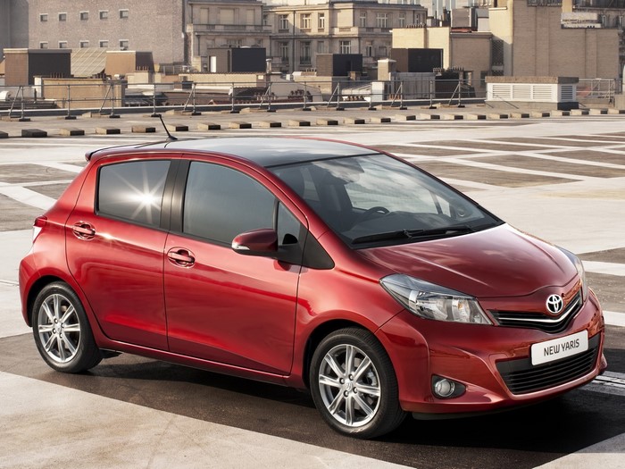 Red Toyota New Yaris parked on a rooftop