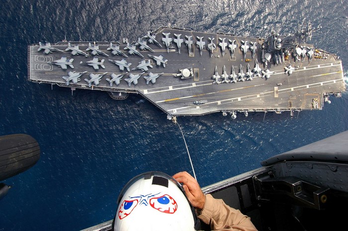 Aircraft carrier with fighter jets from helicopter