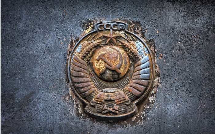 Coat of arms of the USSR on a textured surface