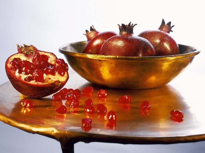 Pomegranates in a golden bowl