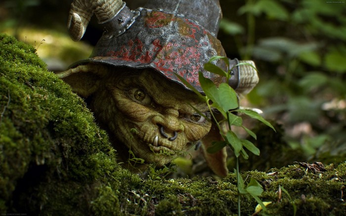 Goblin with horns and nose ring in mossy forest
