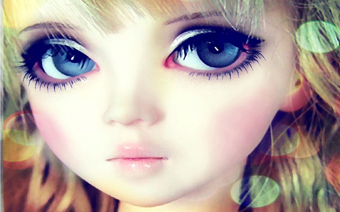 Close-up of a doll's face with blue eyes