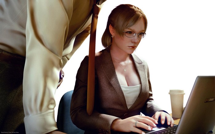 Woman in suit working on laptop