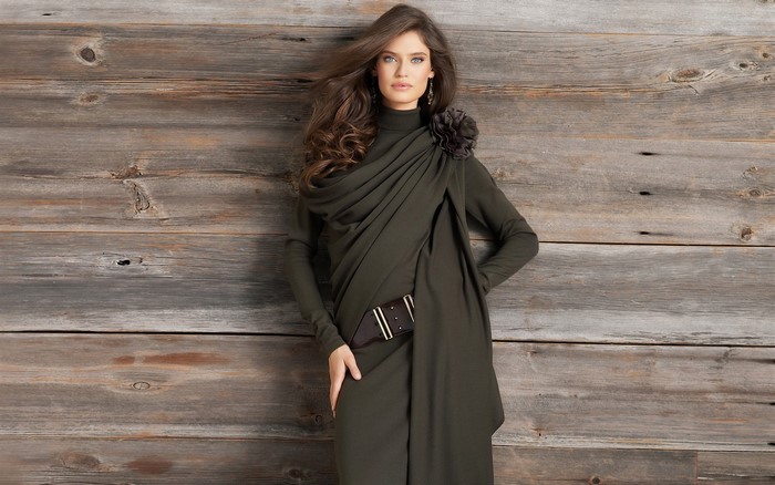 Bianca Balti posing in a green dress