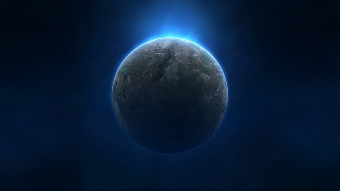 Planet with glowing atmosphere in deep space